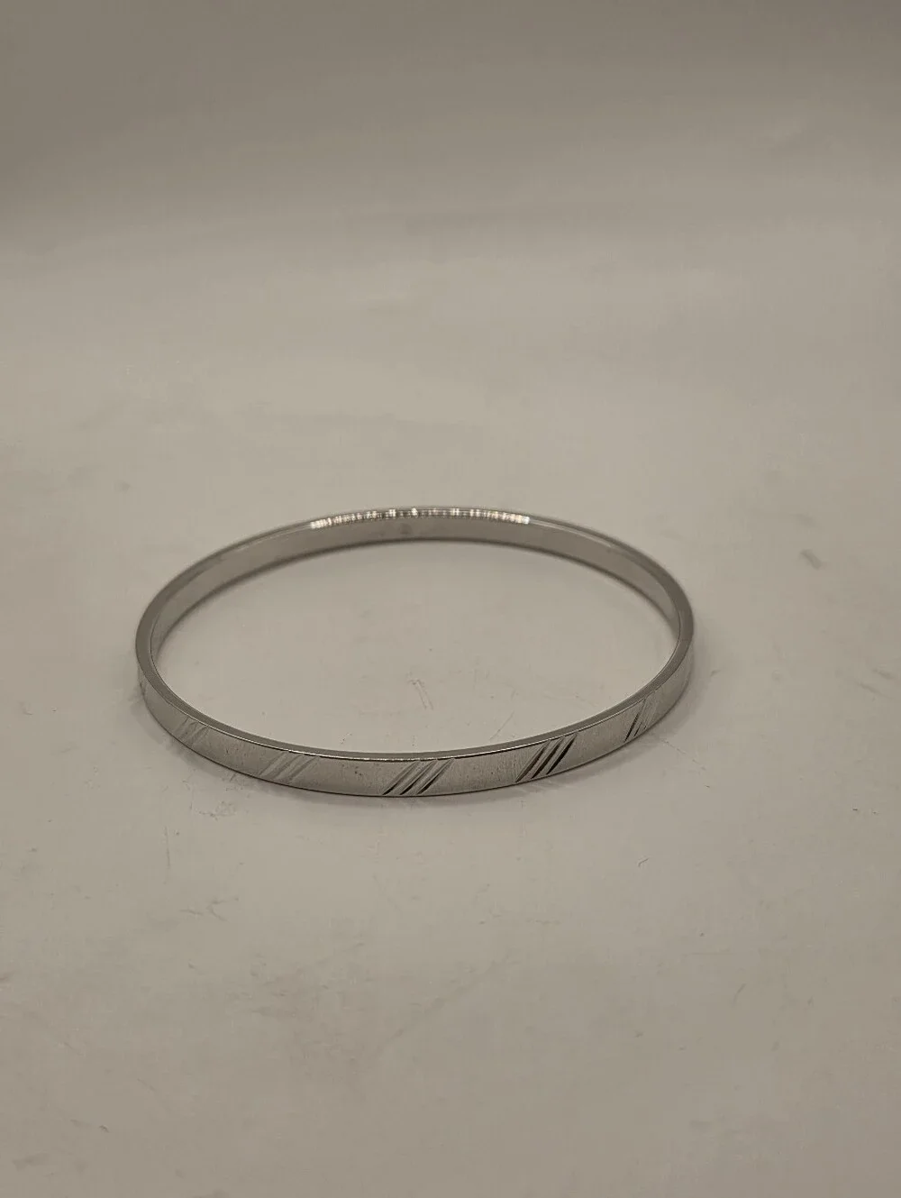 Vintage Monet Silver Tone Bangle Bracelet Textured Diagonal Slash Cut Out Design